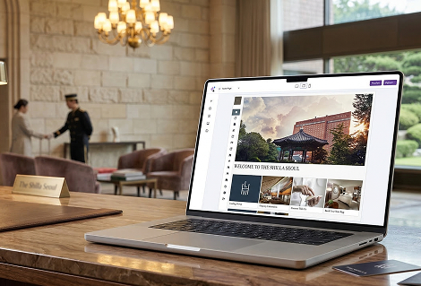 GEMS CMS editing a hotel website, shown in a hotel lobby